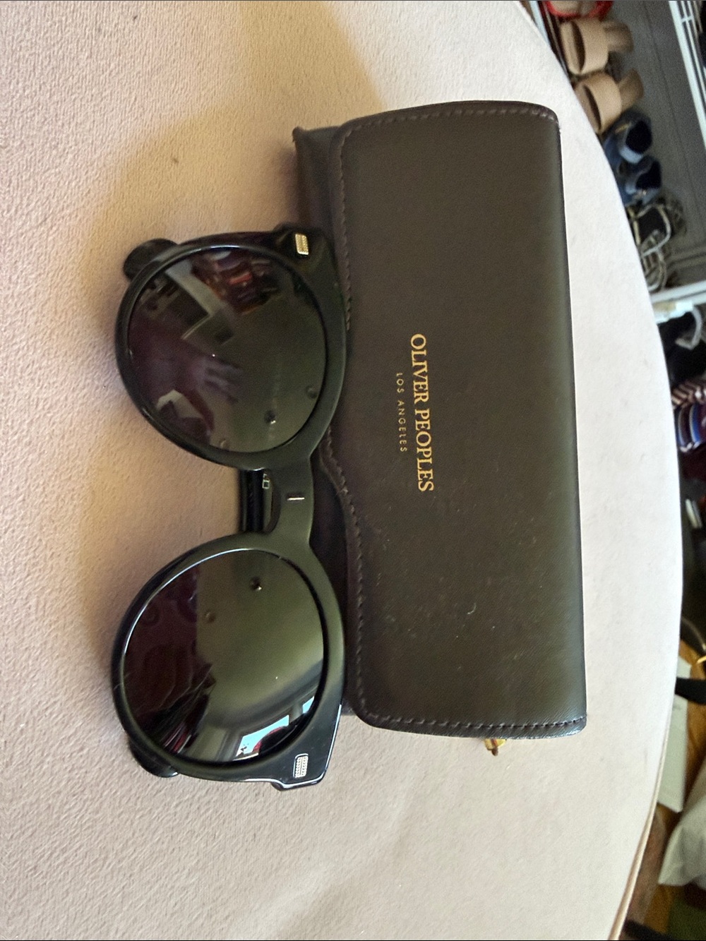 Oliver Peoples Black Round Sunglasses with Brown Case